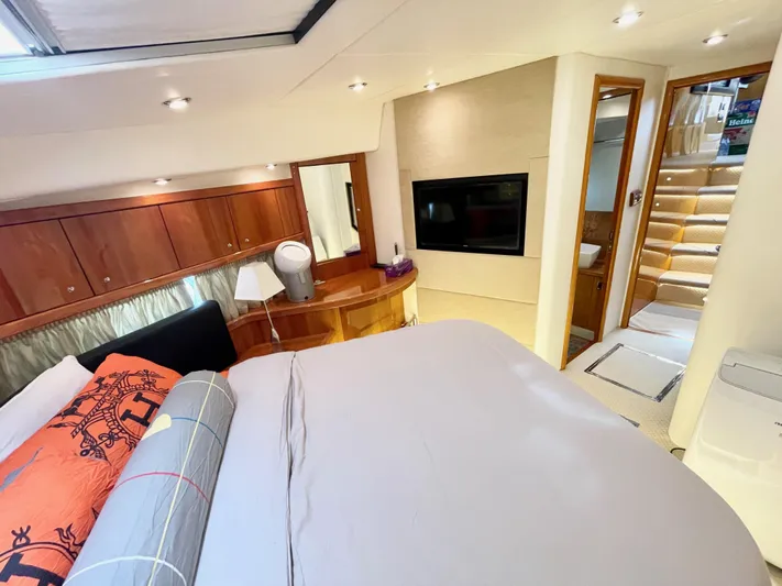 Ellyn Yacht Photos Pics Luxurious bedroom interior of 2010 Sunseeker Manhattan 70 yacht with modern amenities.