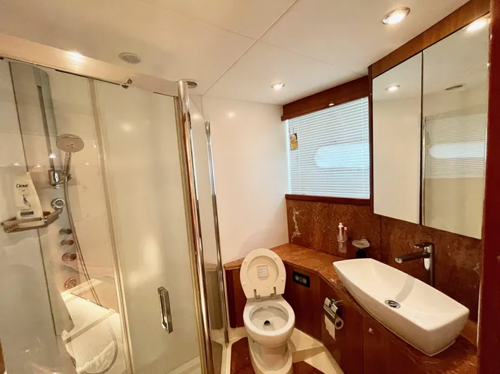 Ellyn Yacht Photos Pics Luxurious bathroom in 2010 Sunseeker Manhattan 70 yacht with modern fixtures and shower.