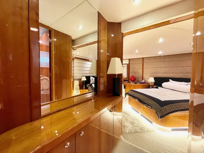 Ellyn Yacht Photos Pics Luxurious interior of 2010 Sunseeker Manhattan 70 yacht with elegant wood finishes and modern lighting.