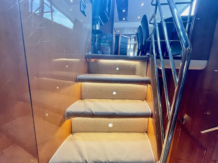 Ellyn Yacht Photos Pics Luxurious interior staircase of 2010 Sunseeker Manhattan 70 yacht with elegant lighting.