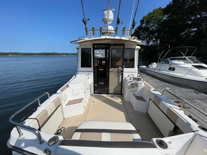  Yacht Photos Pics 2017 Cutwater C-28 boat docked, featuring spacious deck and modern design.