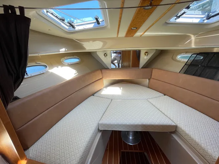  Yacht Photos Pics 2017 Cutwater C-28 interior cabin with skylights and cushioned seating.