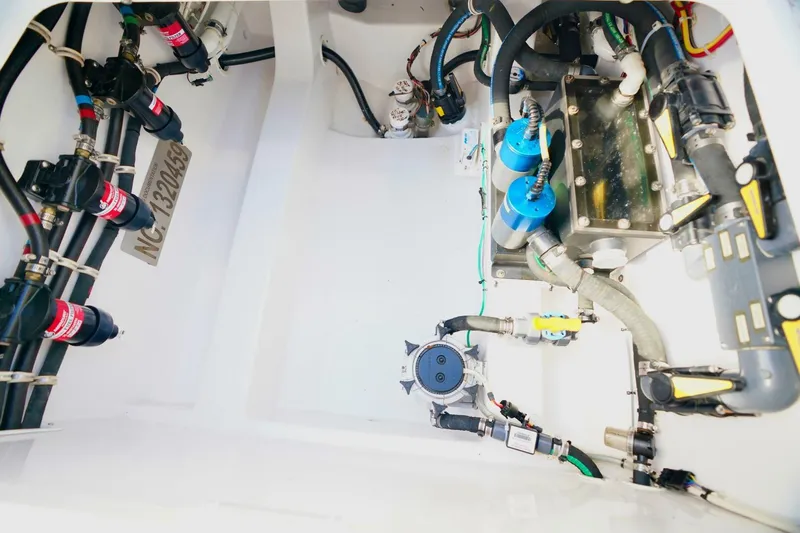 Rhyde Yacht Photos Pics Engine compartment of 2021 Valhalla Boatworks V46, showcasing intricate wiring and components.