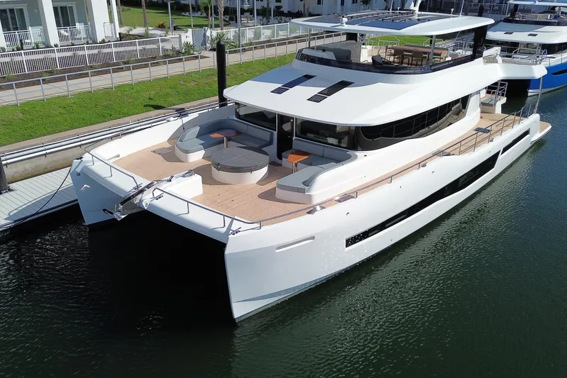 Paso Doble Yacht Photos Pics Luxurious 2025 Granocean W72 yacht docked, featuring sleek design and spacious deck.