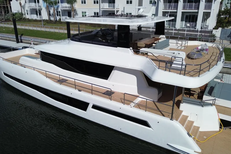 Paso Doble Yacht Photos Pics Luxurious 2025 Granocean W72 yacht docked, showcasing sleek design and spacious decks.