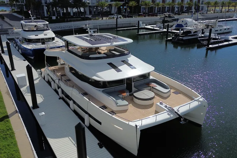 Paso Doble Yacht Photos Pics Luxurious 2025 Granocean W72 yacht docked at marina, showcasing sleek design and spacious deck.