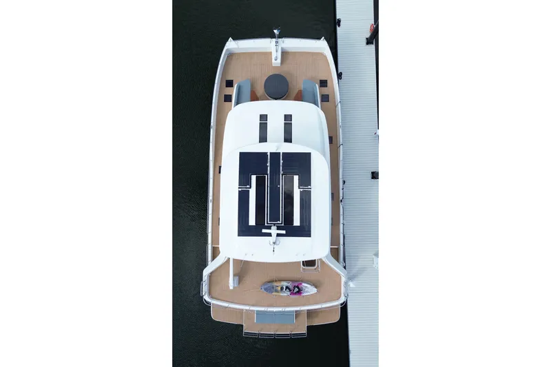 Paso Doble Yacht Photos Pics Overhead view of 2025 Granocean W72 yacht docked, showcasing sleek design and spacious deck.