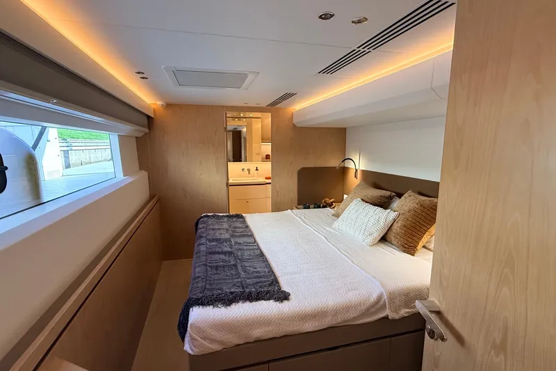 Paso Doble Yacht Photos Pics Luxurious Granocean W72 yacht bedroom, 2025 model, featuring modern design and cozy bedding.