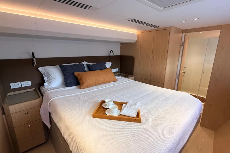 Paso Doble Yacht Photos Pics Luxurious Granocean W72 yacht bedroom with elegant decor and cozy bedding, 2025 model.