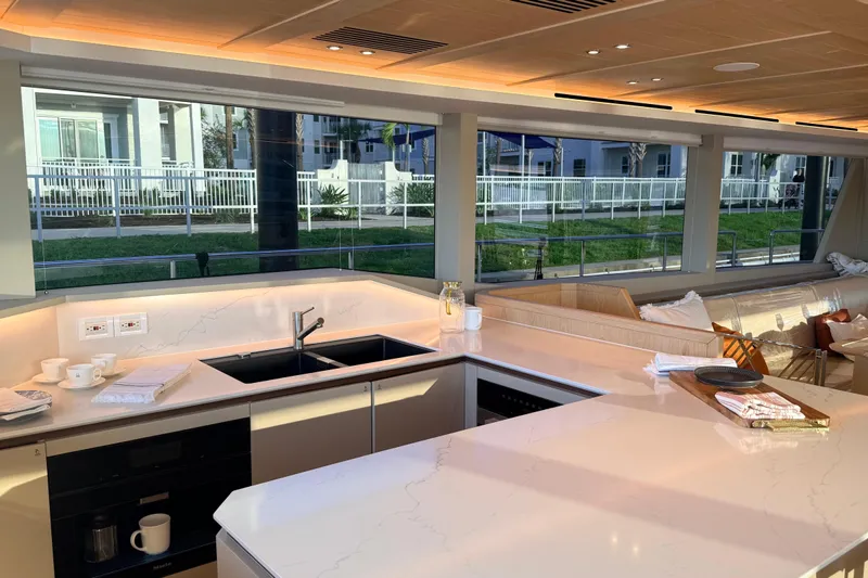 Paso Doble Yacht Photos Pics Luxurious Granocean W72 yacht kitchen interior, featuring sleek countertops and modern design, 2025 model.