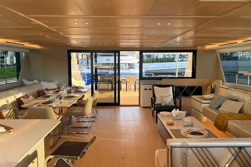 Paso Doble Yacht Photos Pics Luxurious interior of 2025 Granocean W72 yacht with elegant dining and seating areas.