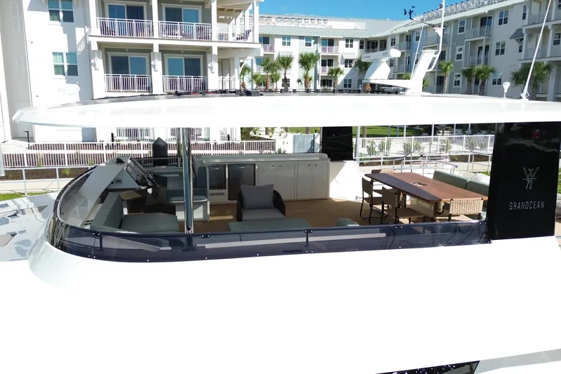 Paso Doble Yacht Photos Pics Luxurious Granocean W72 yacht interior, featuring modern seating and dining area, 2025 model.