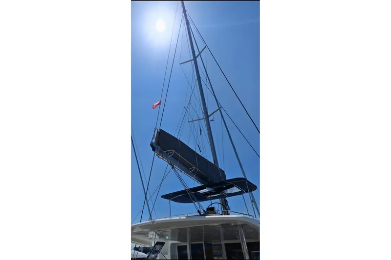 Kuala Yacht Photos Pics Sailing yacht mast of 2015 Lagoon 52 under clear blue sky.