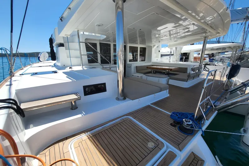 Kuala Yacht Photos Pics Luxurious 2015 Lagoon 52 yacht deck with seating and dining area.