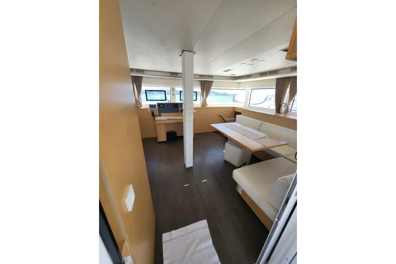 Kuala Yacht Photos Pics Interior of 2015 Lagoon 52 yacht with modern seating and navigation area.