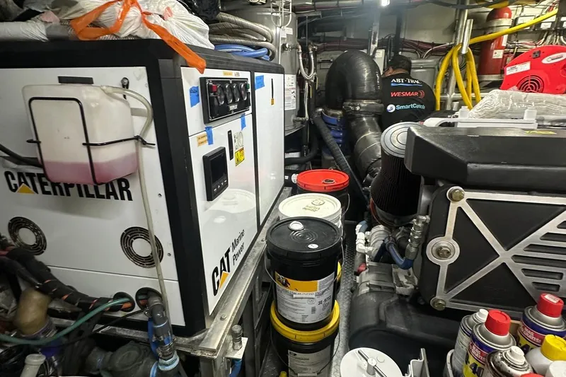 Adventurer Yacht Photos Pics Engine room of a 1985 Burger 94 yacht with Caterpillar machinery and maintenance supplies.