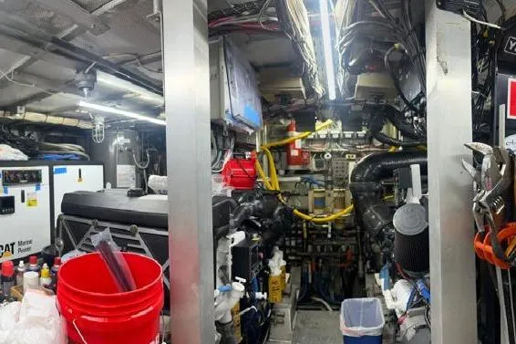 Adventurer Yacht Photos Pics Engine room of a 1985 Burger 94 yacht, featuring tools and equipment.