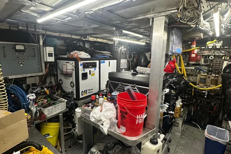 Adventurer Yacht Photos Pics Engine room of a 1985 Burger 94 yacht with Caterpillar marine power equipment.