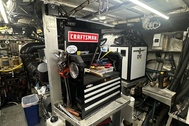 Adventurer Yacht Photos Pics Engine room of 1985 Burger model 94 yacht with Craftsman tool chest and CAT machinery.