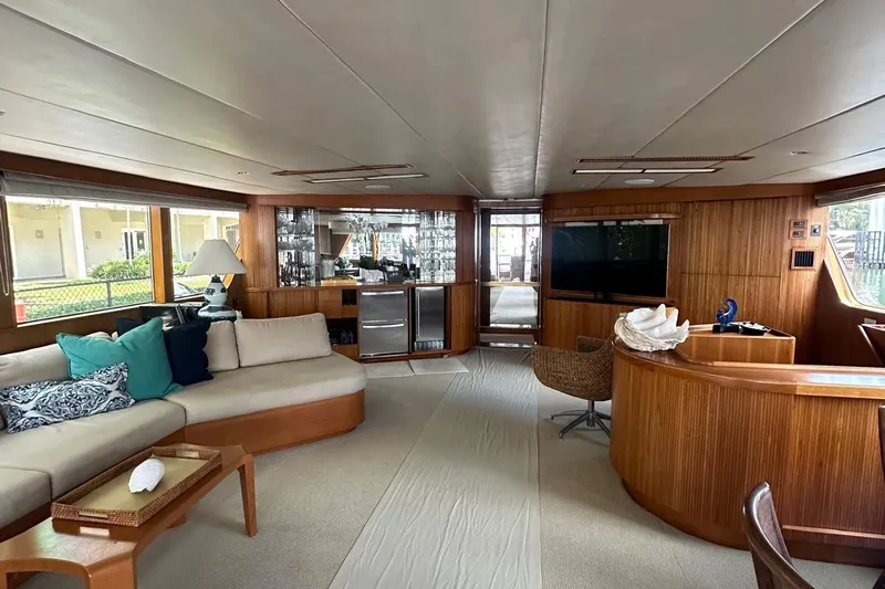 Adventurer Yacht Photos Pics Luxurious 1985 Burger 94 yacht interior with elegant wood paneling and modern furnishings.