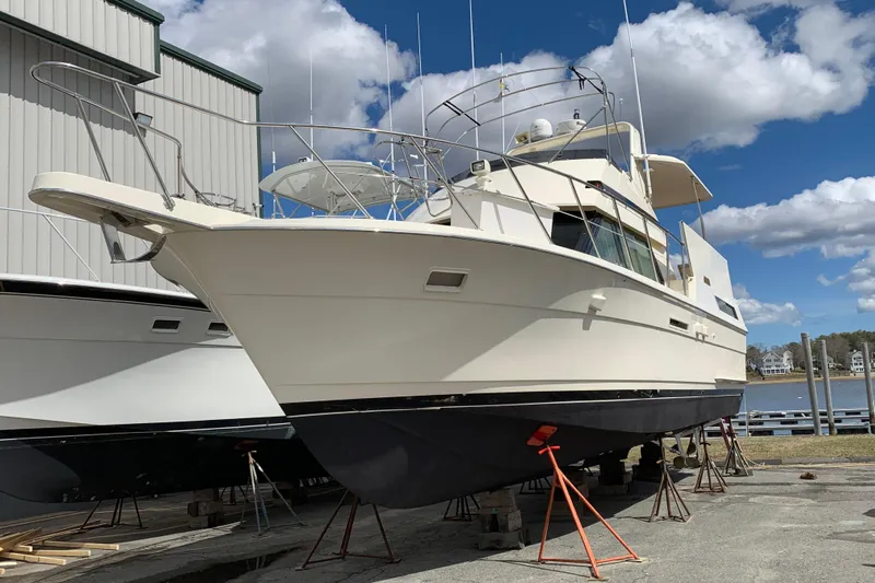 Sea Trial Yacht Photos Pics 1991 Hatteras 40 Motor Yacht on dry dock under a blue sky.