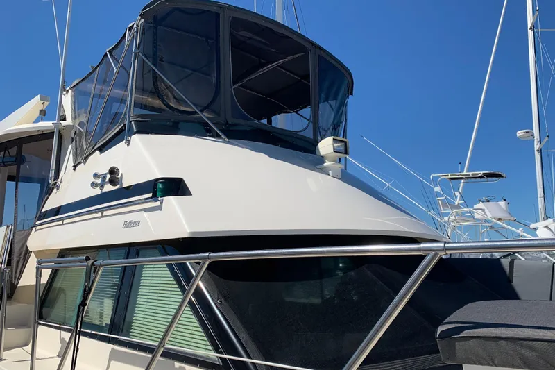 Sea Trial Yacht Photos Pics 1991 Hatteras 40 Motor Yacht with sleek design, docked under clear blue sky.