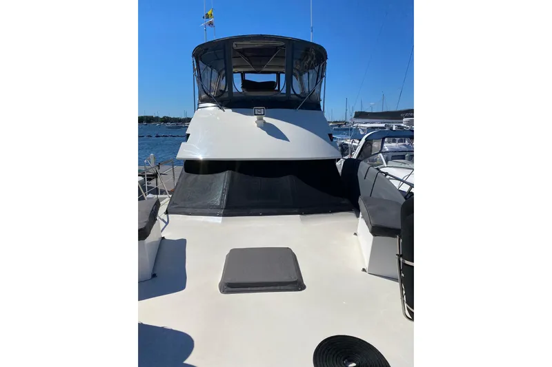 Sea Trial Yacht Photos Pics 1991 Hatteras 40 Motor Yacht on water, featuring spacious deck and sleek design.