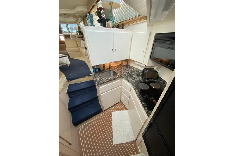 Sea Trial Yacht Photos Pics 1991 Hatteras 40 Motor Yacht interior kitchen with modern appliances and sleek design.