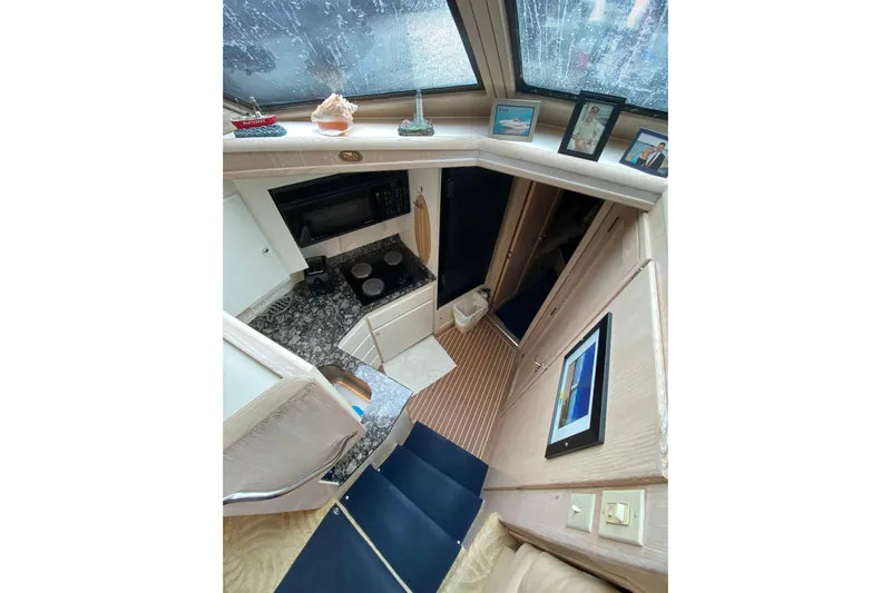 Sea Trial Yacht Photos Pics Interior of 1991 Hatteras 40 Motor Yacht with kitchen and decor elements.