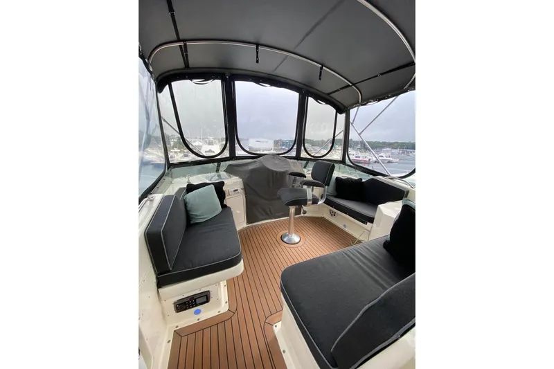 Sea Trial Yacht Photos Pics Interior view of 1991 Hatteras 40 Motor Yacht with seating and helm.
