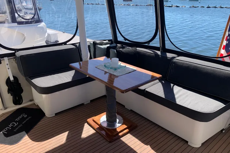 Sea Trial Yacht Photos Pics Cozy seating area on 1991 Hatteras 40 Motor Yacht with waterfront view.