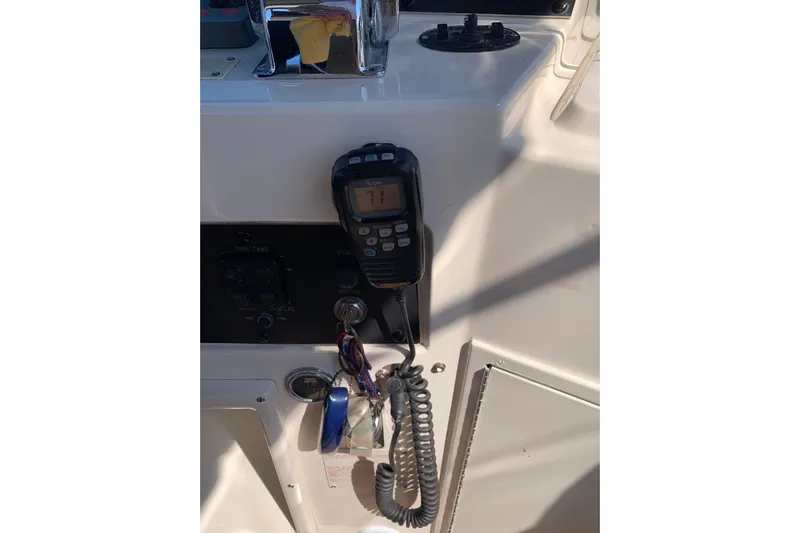 Sea Trial Yacht Photos Pics Control panel of a 1991 Hatteras 40 Motor Yacht with radio and ignition keys.