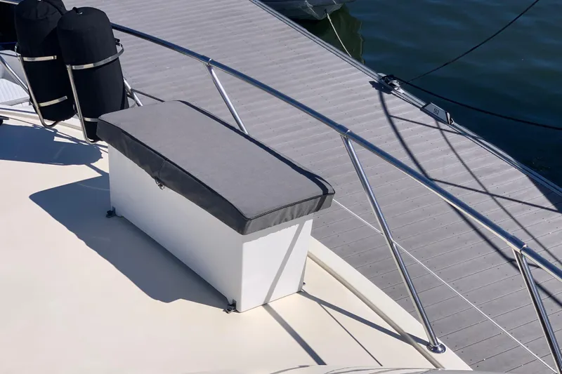 Sea Trial Yacht Photos Pics 1991 Hatteras 40 Motor Yacht deck with cushioned seating and railing.