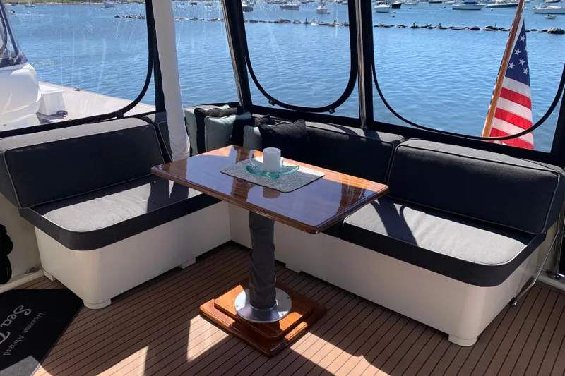 Sea Trial Yacht Photos Pics Cozy seating area on 1991 Hatteras 40 Motor Yacht with scenic water view.