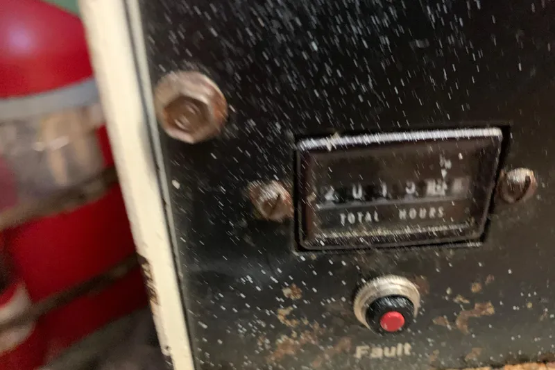 Sea Trial Yacht Photos Pics Close-up of a 1991 Hatteras 40 Motor Yacht engine hour meter and fault button.