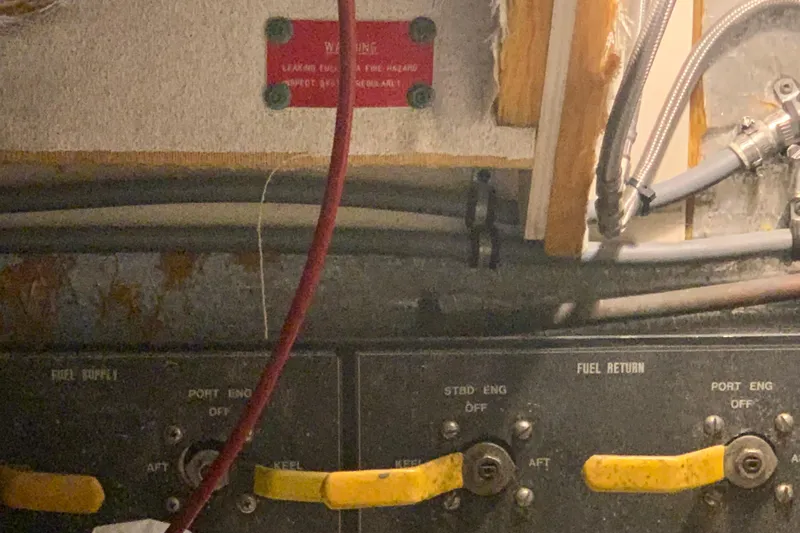 Sea Trial Yacht Photos Pics Control panel of a 1991 Hatteras 40 Motor Yacht engine room with fuel supply and return valves.