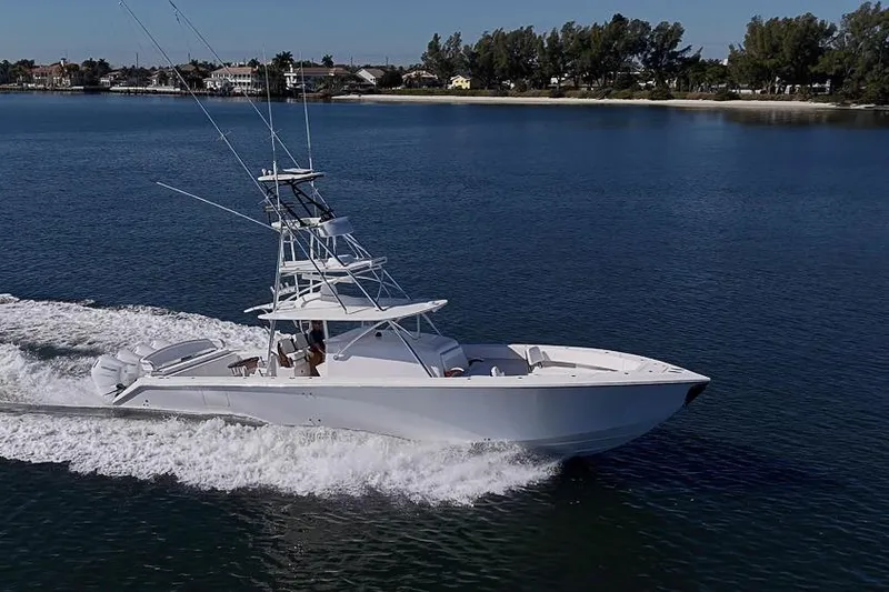  Yacht Photos Pics A 2025 Sparks 46 yacht cruising on a calm, scenic waterway.