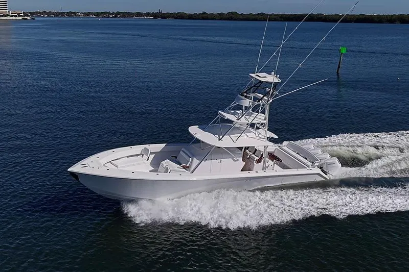  Yacht Photos Pics 2025 Sparks 46 boat cruising on a calm blue sea.