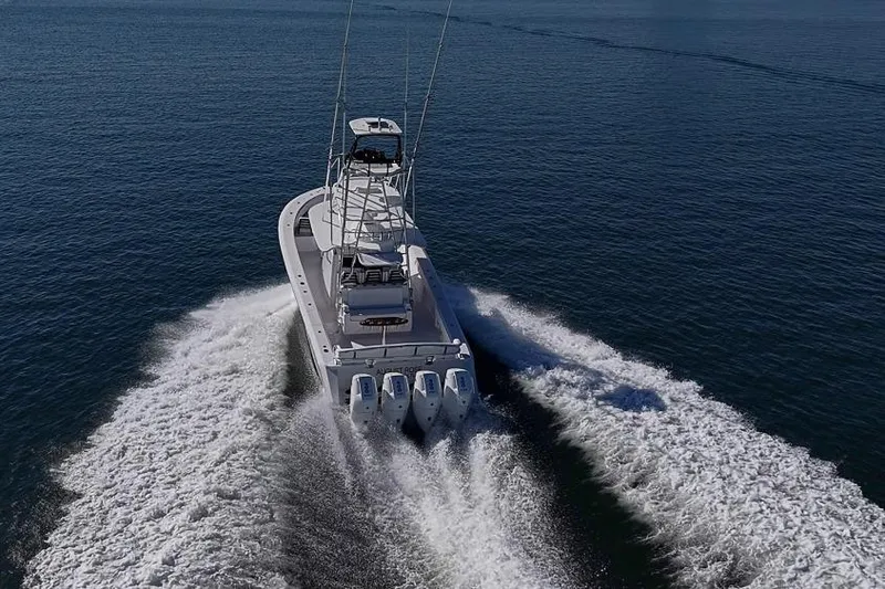  Yacht Photos Pics A 2025 Sparks 46 boat cruising on open water, leaving a wake behind.