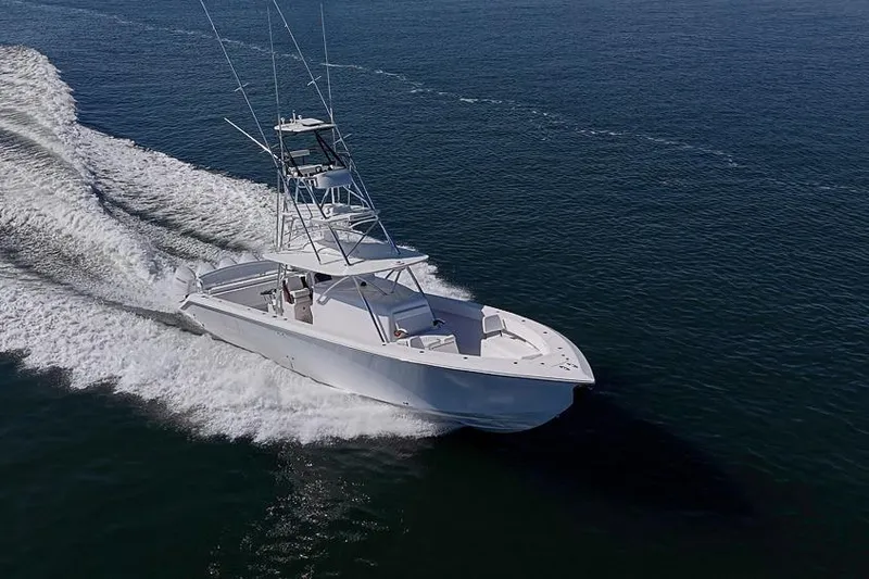  Yacht Photos Pics A 2025 Sparks 46 boat cruising swiftly on open water.