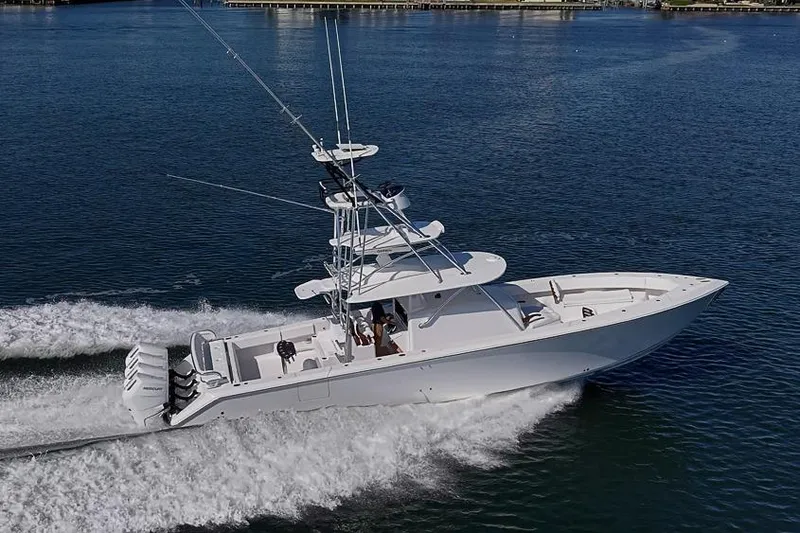  Yacht Photos Pics Sparks 46 boat cruising on water, 2025 model, with multiple outboard engines.