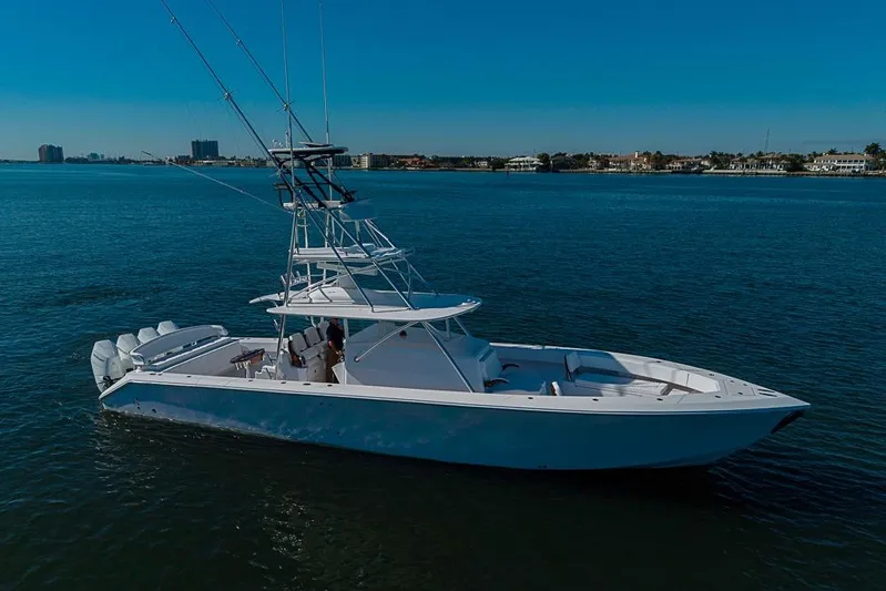  Yacht Photos Pics Sparks 46 yacht, 2025 model, cruising on calm blue waters under a clear sky.