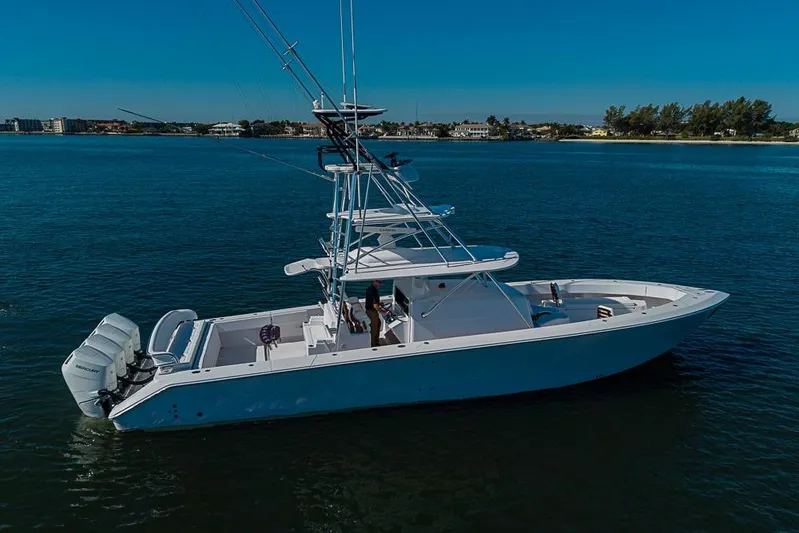  Yacht Photos Pics A 2025 Sparks 46 boat cruising on calm blue waters under a clear sky.