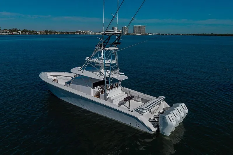  Yacht Photos Pics A 2025 Sparks 46 boat with multiple engines cruising on calm blue waters.