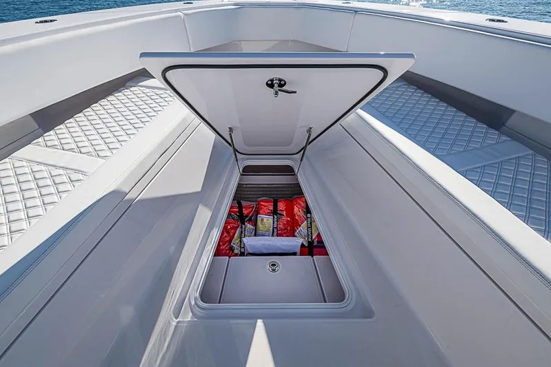  Yacht Photos Pics Open storage compartment on Sparks 46 boat, 2025 model, with safety equipment inside.
