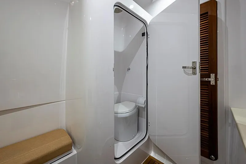  Yacht Photos Pics Modern bathroom interior in 2025 Sparks 46 yacht, featuring sleek design and compact toilet.