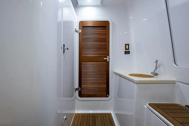  Yacht Photos Pics Modern yacht bathroom with wooden accents, featuring a sleek design. Sparks 46, 2025 model.