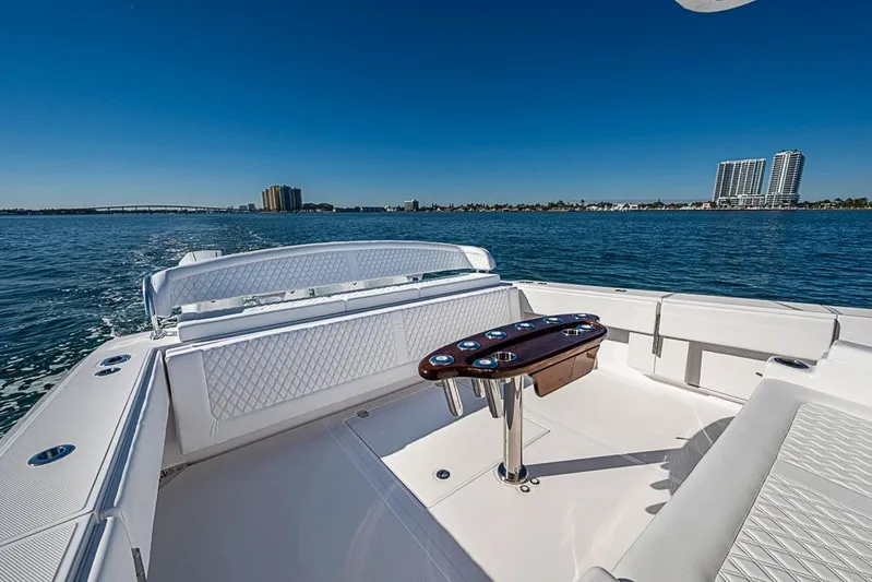  Yacht Photos Pics Luxurious Sparks 46 boat interior, 2025 model, cruising on a sunny day with city skyline.