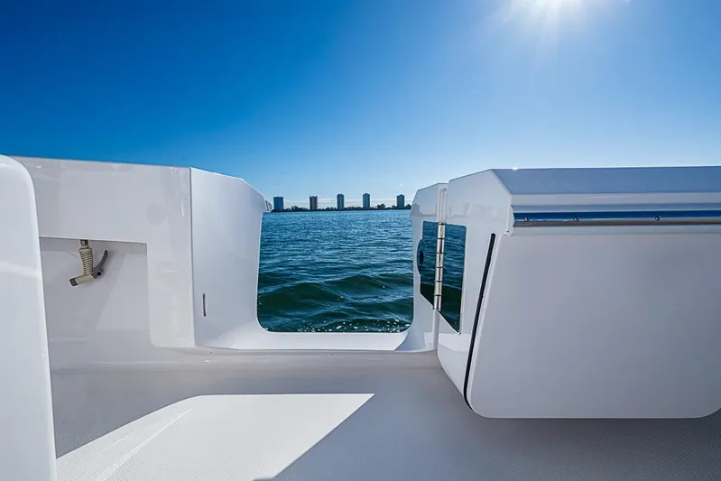  Yacht Photos Pics 2025 Sparks 46 boat deck with ocean view under clear blue sky.