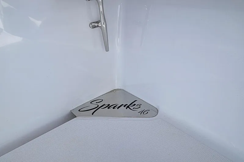  Yacht Photos Pics Sleek interior of 2025 Sparks 46 boat with stylish branding.